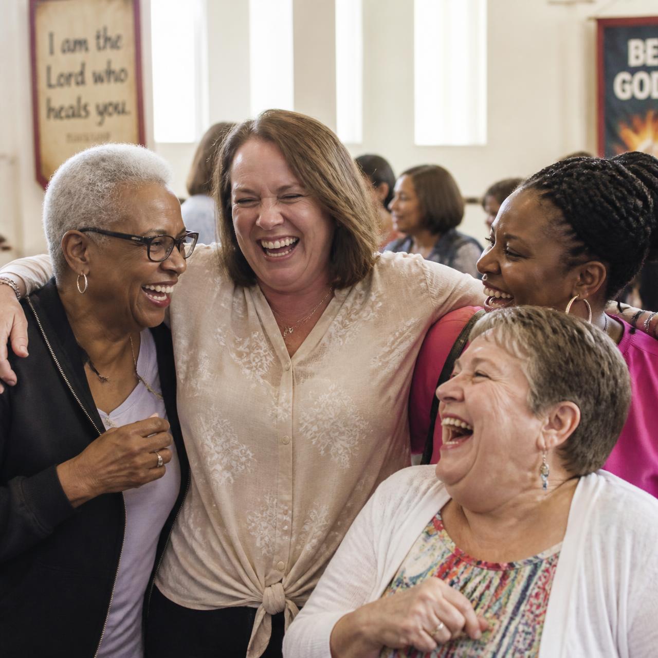 Women laughing together at a church gathering
